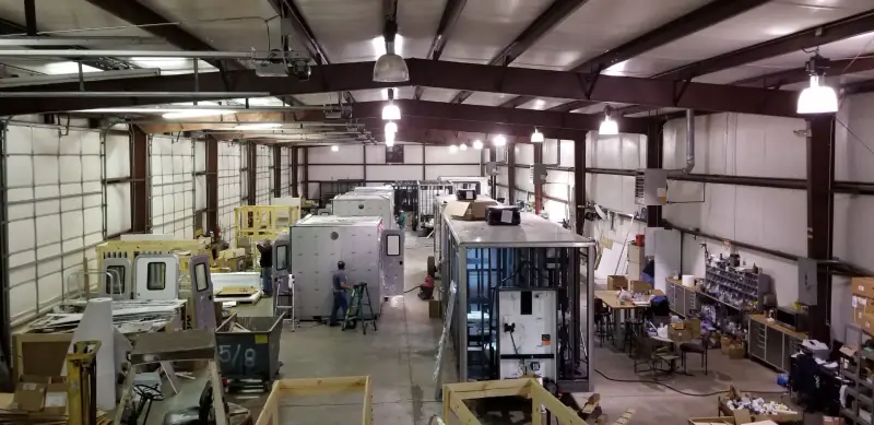 Restroom units under construction in a fabrication shop