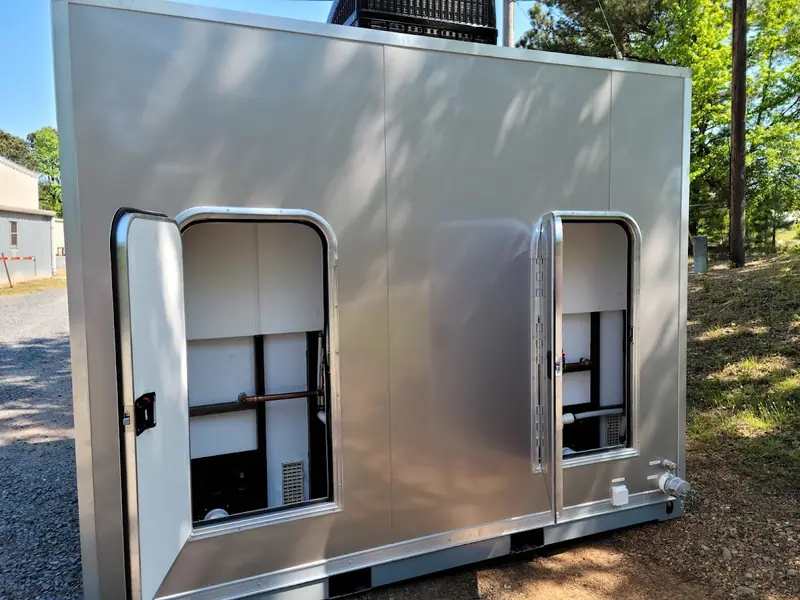 Restroom skid with its service panels open
