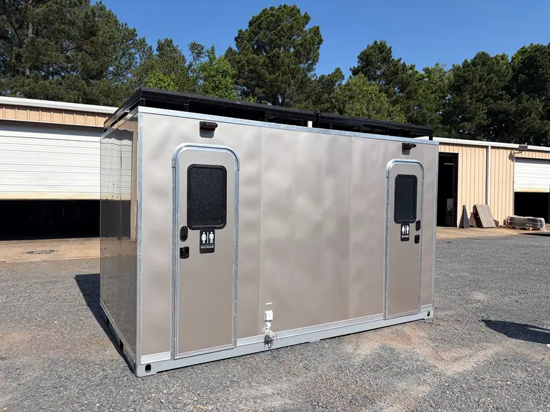Comfort Isle 12 2ST J off grid restroom skid outside the plant