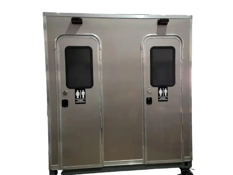 The CI 8 - 2 Stall Restroom Skid (8 ft) is a metal trailer with two doors, each with a small window and unisex restroom signs. This portable unit is ideal for events and available in ADA compliant models.
