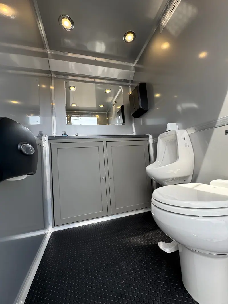 Men’s room interior of a station restroom trailer