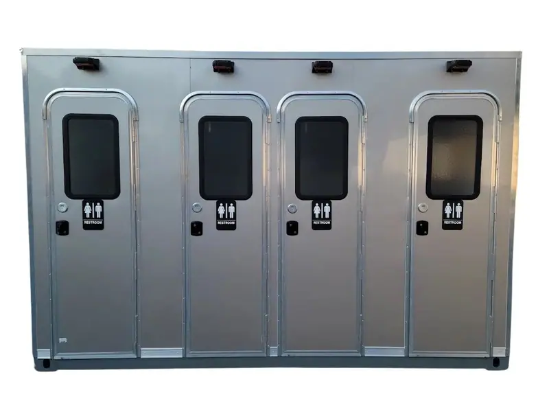 The CI 12 - 4 Stall Restroom Skid (12 ft) features four silver doors, each labeled for men's, women's, and ADA restroom access.