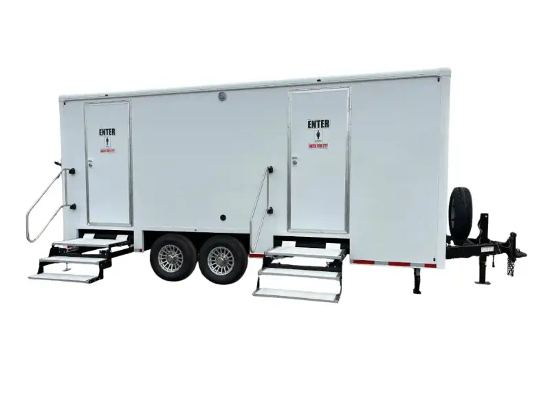 The Station Restroom Trailer (20' x 8.5') is a white dual-axle ADA unit with two "Enter" doors, metal steps for access, and a front-mounted spare tire.