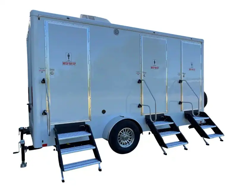 The 3 Person Stall Restroom Trailer (16' x 6') is shown on a white background, featuring three separate doors with steps and an ADA-compliant restroom for accessibility.